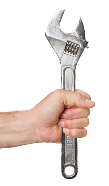 someone-s-hand-holding-spanner.jpg